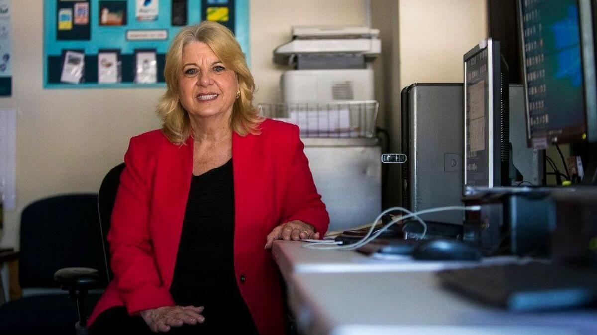 Kathy Tillotson sits in the offices of Build Futures, her Huntington Beach nonprofit. It works to help homeless people ages 18 to 24 find housing and jobs.