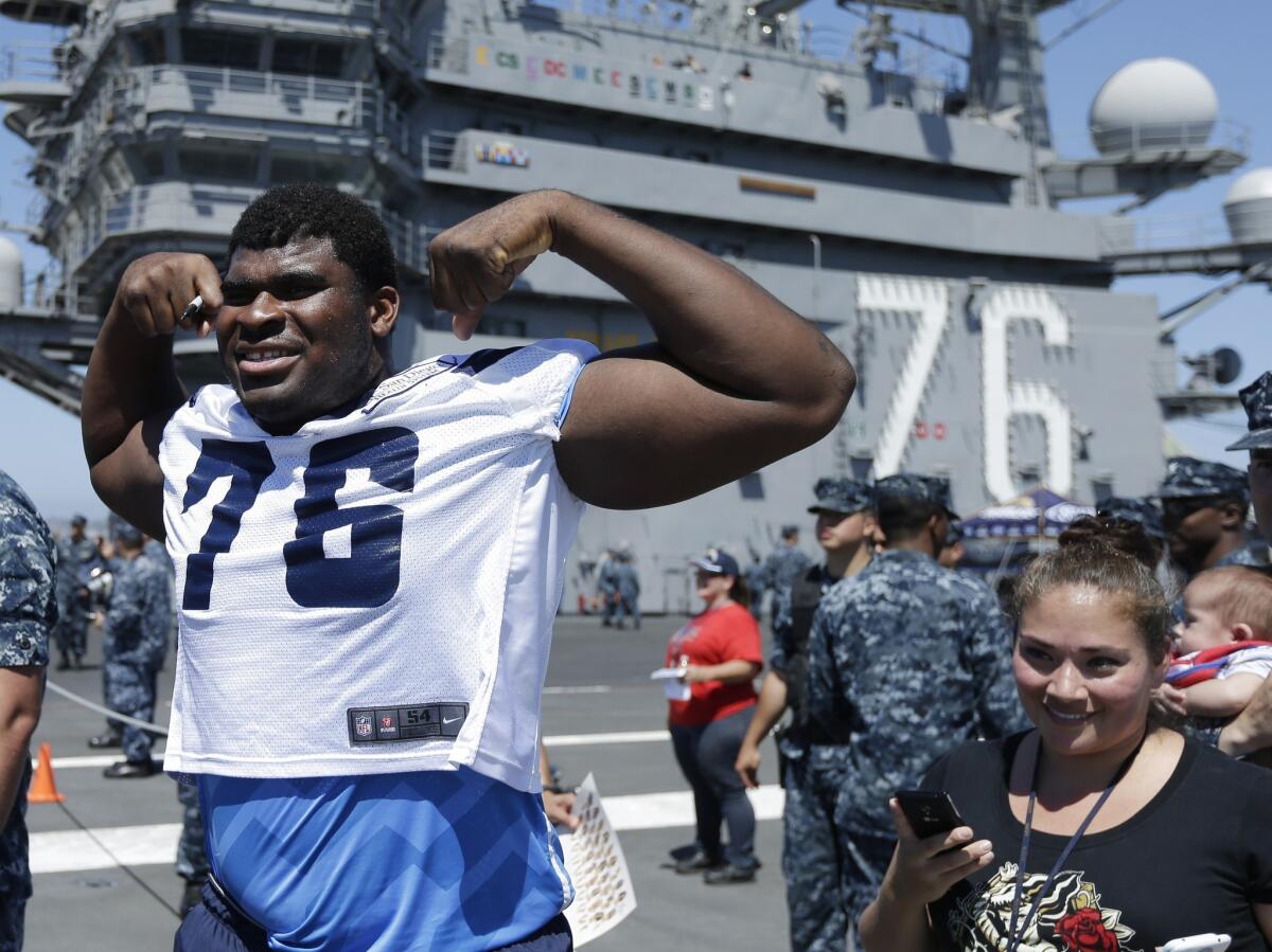 San Diego Chargers offensive tackle D.J. Fluker poses while taking part in a training camp session on the flight deck of the aircraft carrier Ronald Reagan in Coronado. A Yahoo Sports report says Fluker received impermissible benefits while at Alabama.