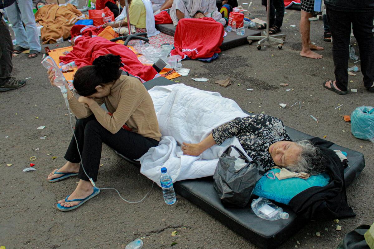 Earthquake survivors being treated out in the open in Indonesia