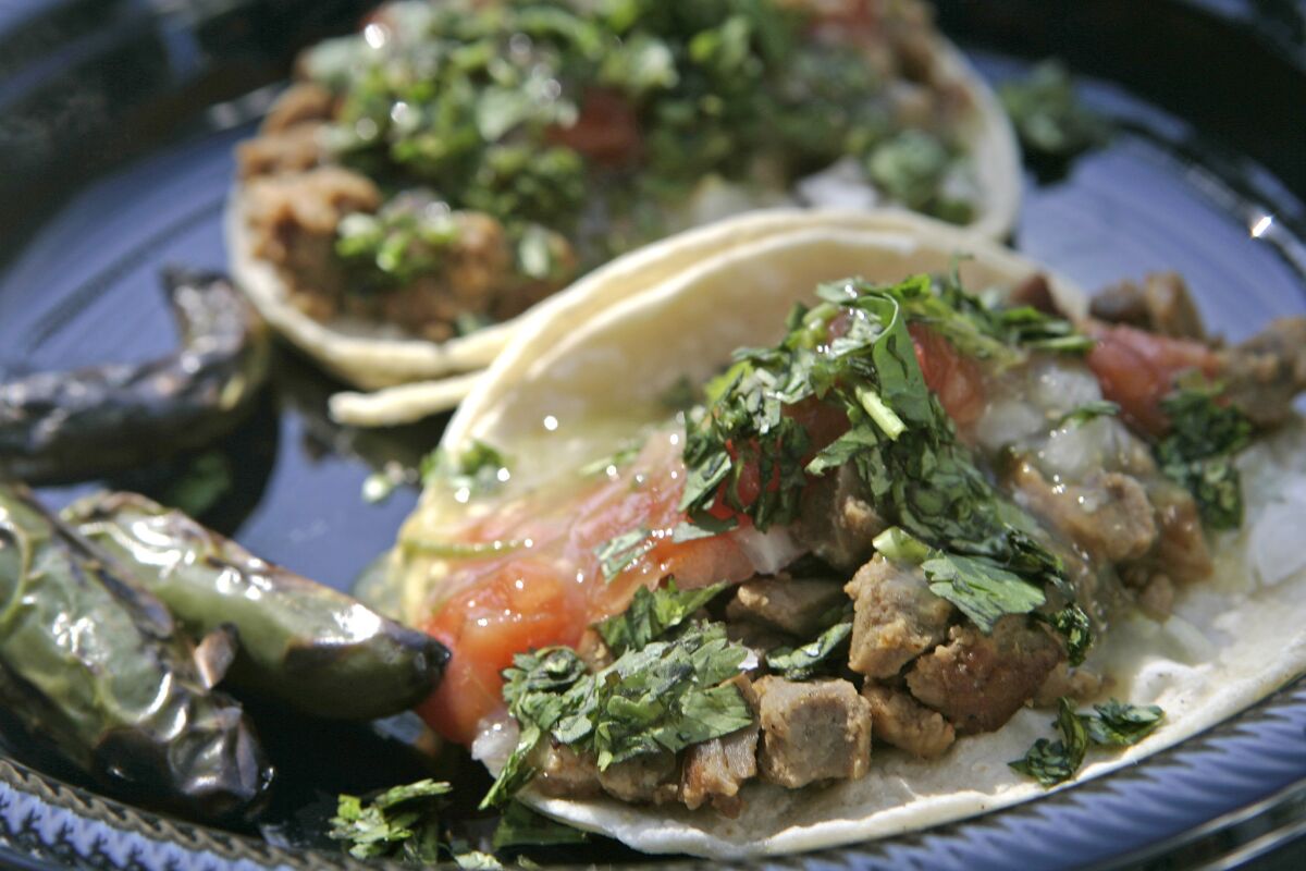 Carne asada tacos, a meaty main dish. Read the recipe.