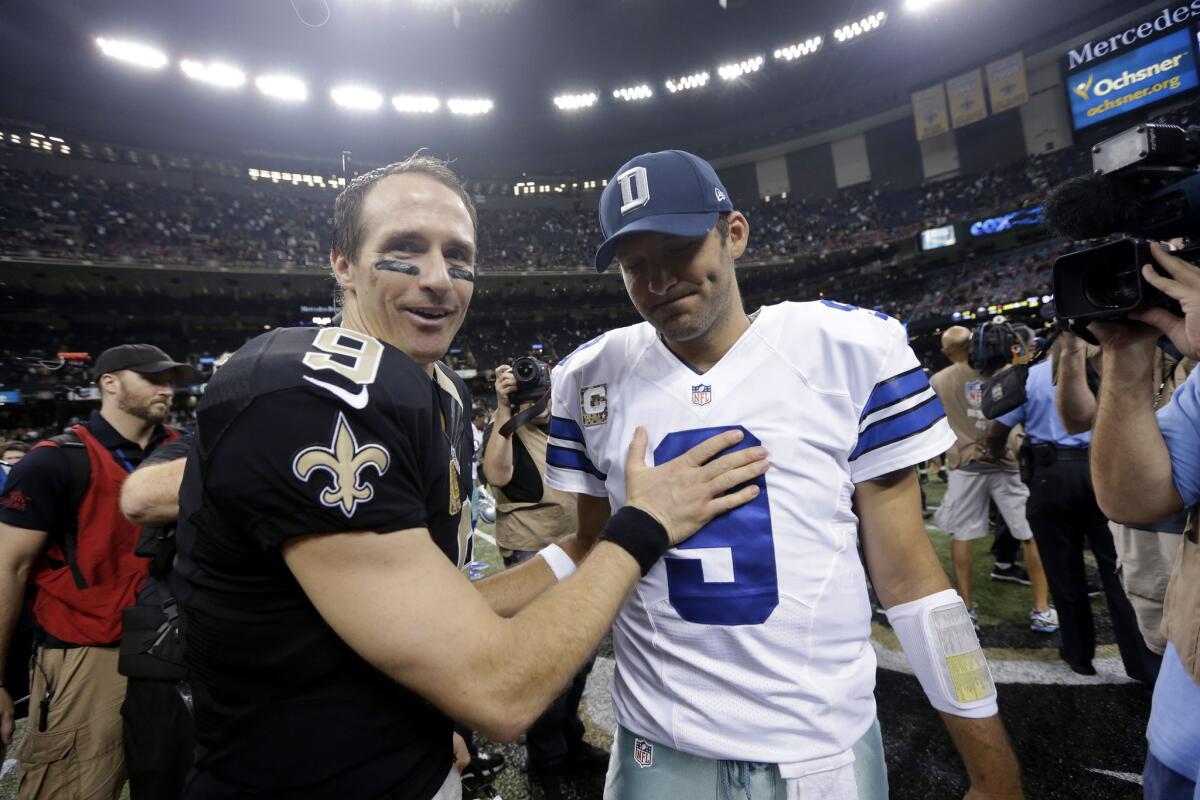 New Orleans Saints quarterback Drew Brees greets Dallas Cowboys quarterback Tony Romo after their game.