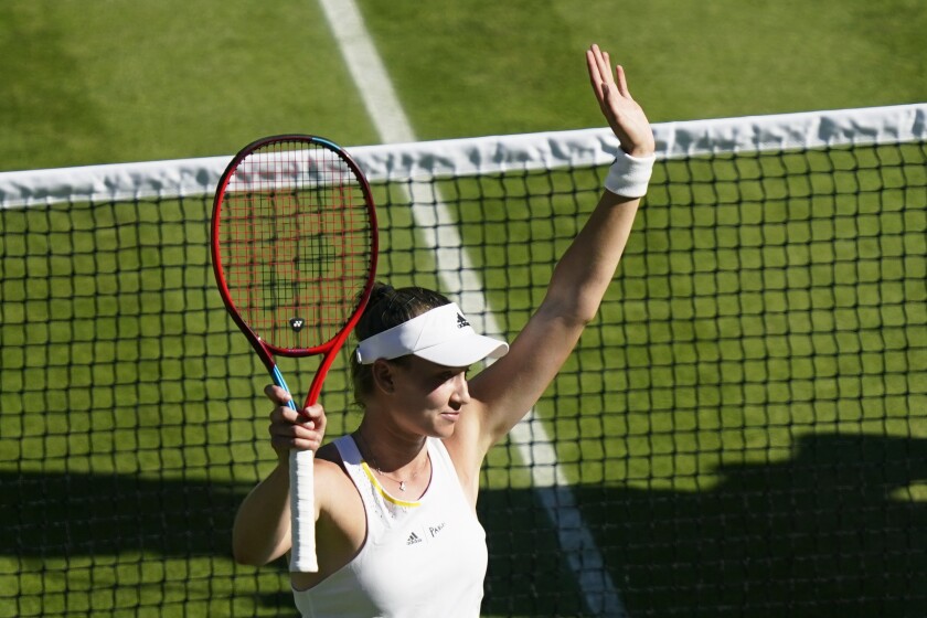 Elena Rybakina reacts to defeating Simona Halep in their Wimbledon women's singles semifinal match.