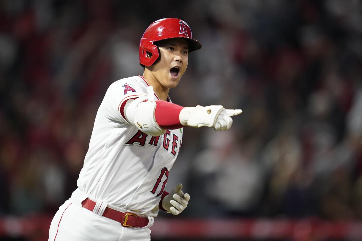 Shohei Ohtani (17) reacts as he runs the bases after hitting a grand slam home run on Monday.