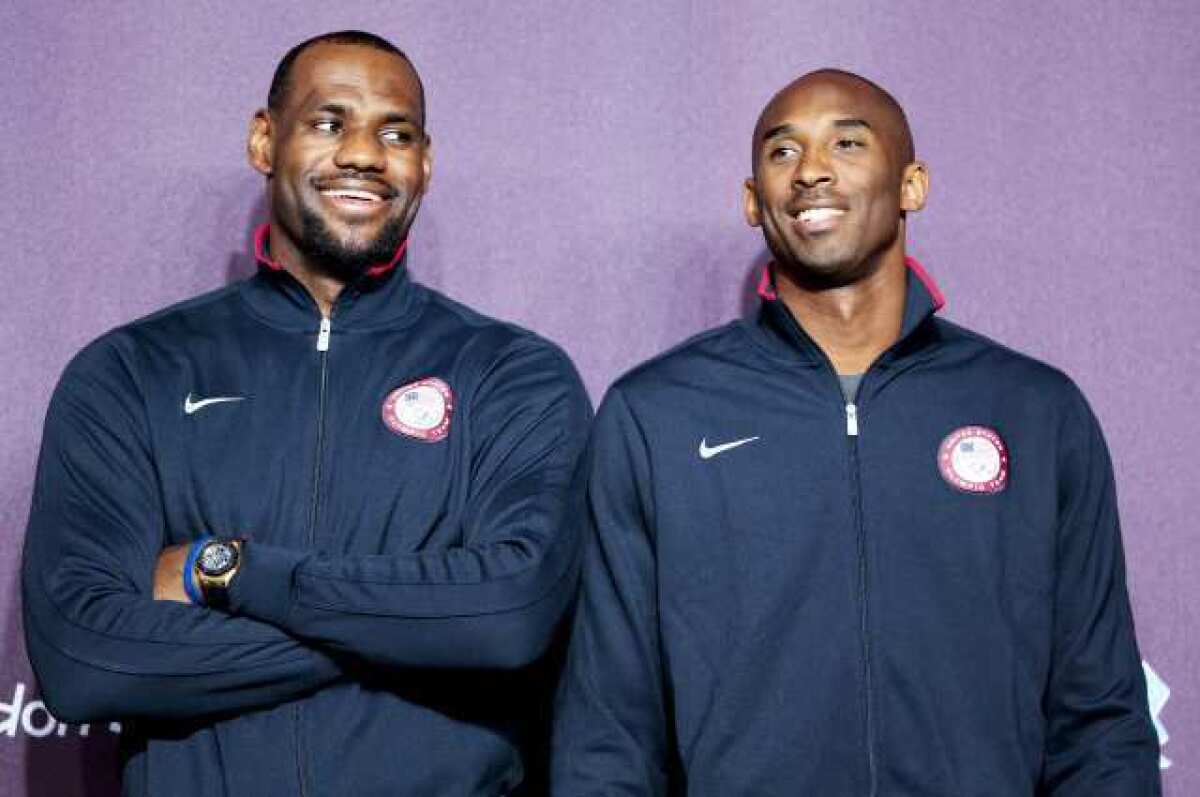 LeBron James and Kobe Bryant speak during a Olympic Games news conference on Friday. They also have more to speak about with each other, now that James has an NBA championship ring too.