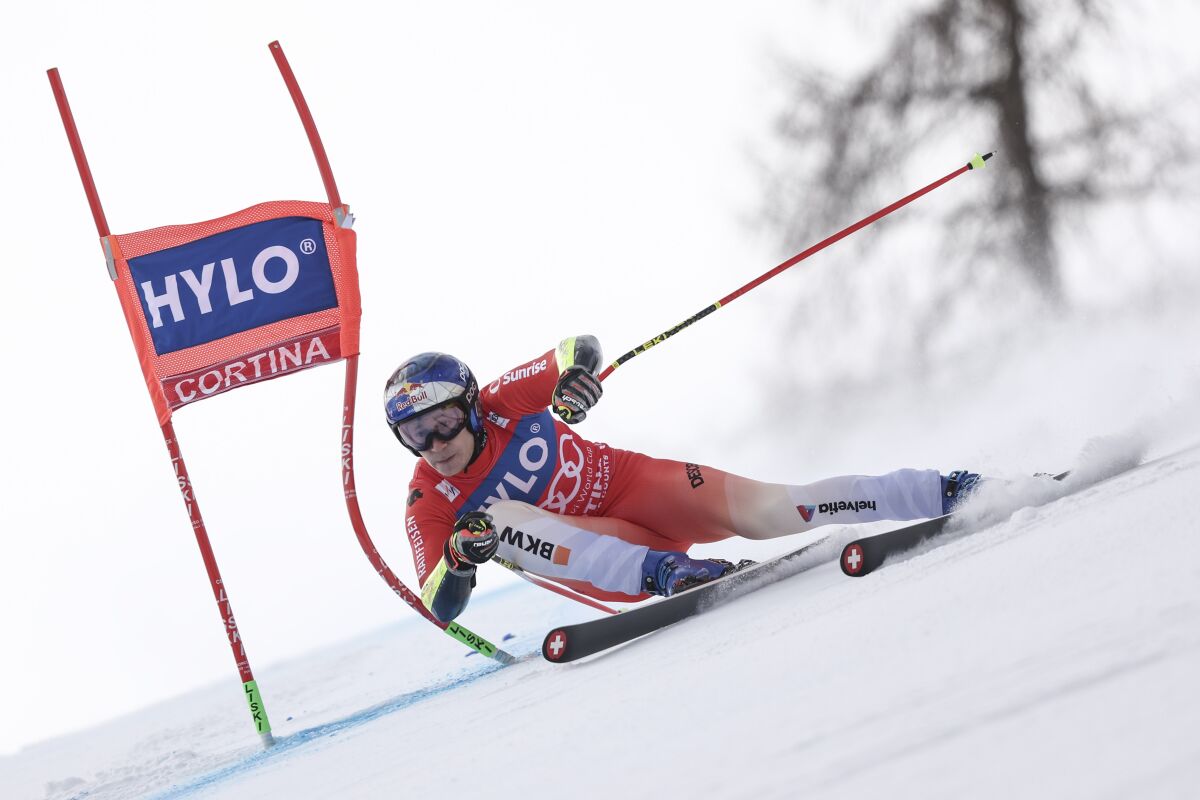FILE - Switzerland's Marco Odermatt competes during an alpine ski, men's World Cup super-G, in Cortina d'Ampezzo, Italy, Saturday, Jan. 28, 2023. A quick glance at the top male skiers to watch for at the world championships in Courchevel and Meribel, France, starting Feb. 6, 2023. (AP Photo/Gabriele Facciotti, File)