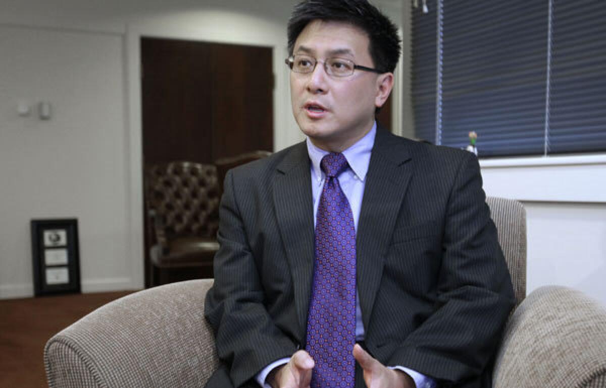 State Controller John Chiang, seen last year, says managers in the California parks department improperly boosted salaries with "deliberate disregard for internal controls, along with little oversight and poorly trained staff."
