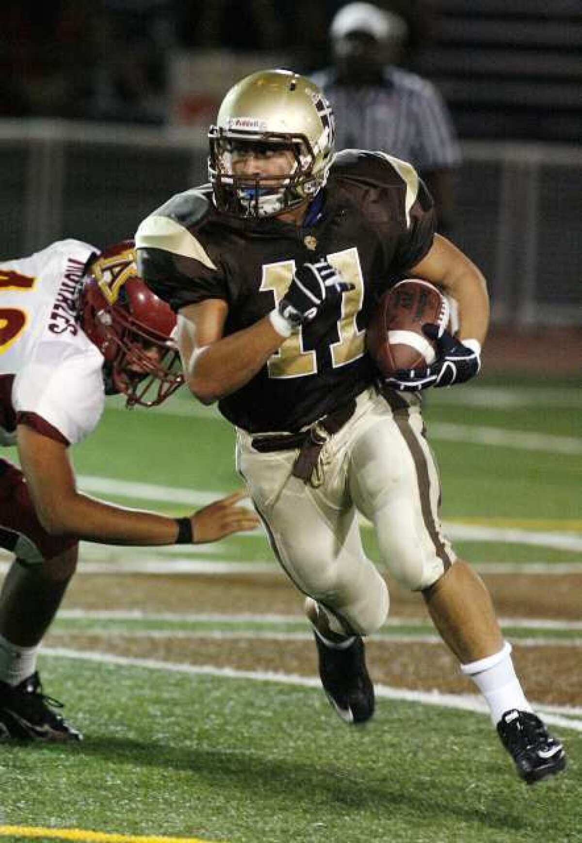 St. Francis' Daniel Kawamura carries the ball in the first quarter against Arcadia.