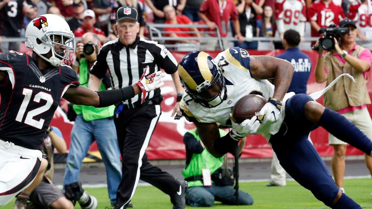 Rams cornerback Trumaine Johnson (22) intercepts a pass in the end zone intended for Arizona Cardinals receiver John Brown (12) during a game Oct. 2.