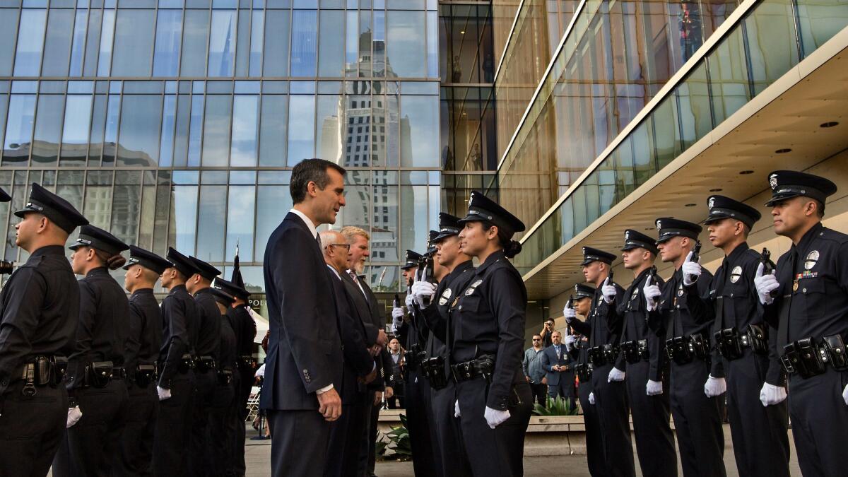 Los Angeles Mayor Eric Garcetti inspects a class of incoming police officers during an October 2014 graduation ceremony at the LAPD's downtown headquarters.