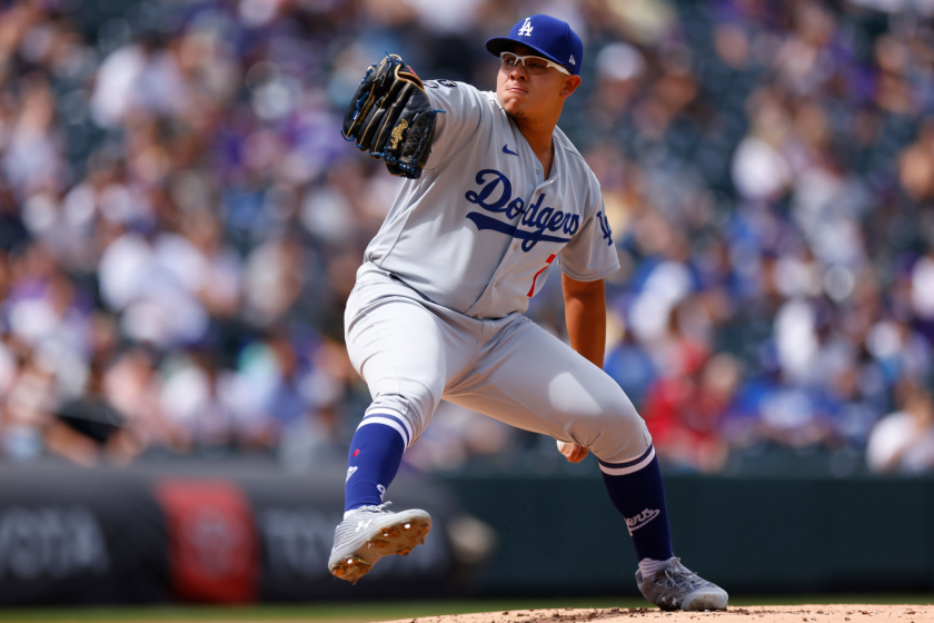 DENVER, CO - APRIL 4: Starting pitcher Julio Urias #7 of the Los Angeles Dodgers delivers.