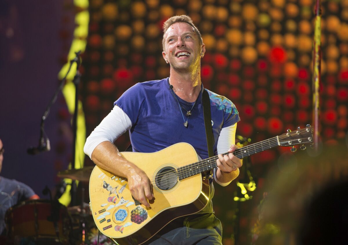 FILE - Chris Martin of Coldplay performs at Metlife Stadium on Aug. 1, 2017, in East Rutherford, N.J. Coldplay's latest album, “Music of the Spheres,” releases Oct. 15. (Photo by Scott Roth/Invision/AP, File)