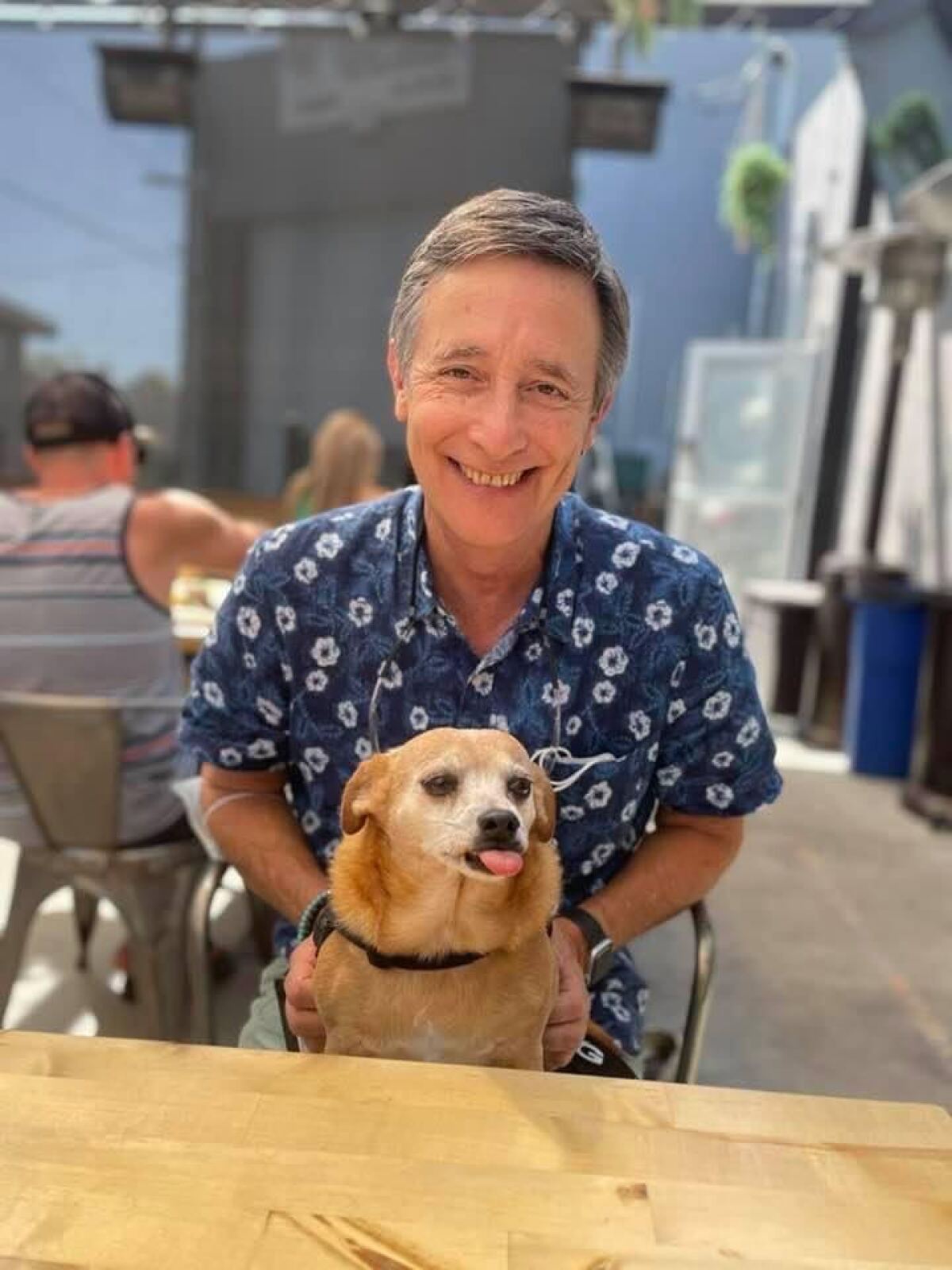 Point Loma resident Jack Abbott sits with his prized chiweenie, Lolabeth.