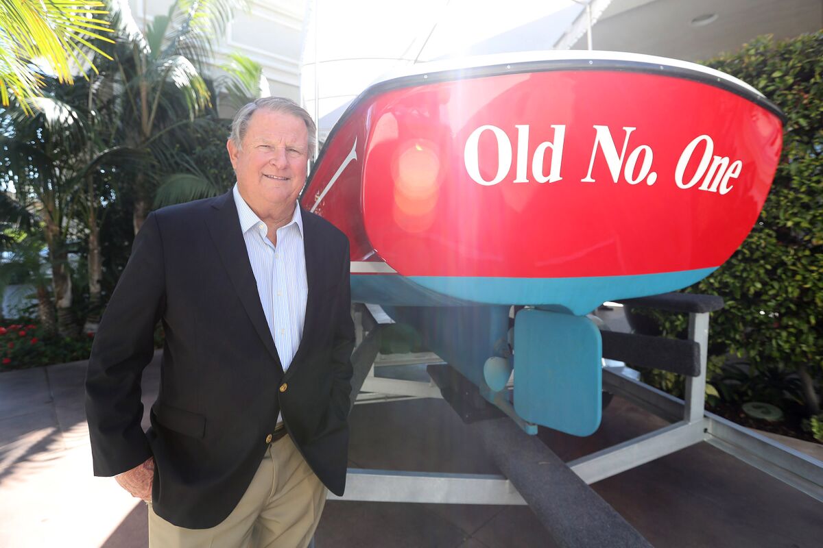 Marshall "Duffy" Duffield stands next to his first "Duffy" electric boat at the Balboa Bay Resort.