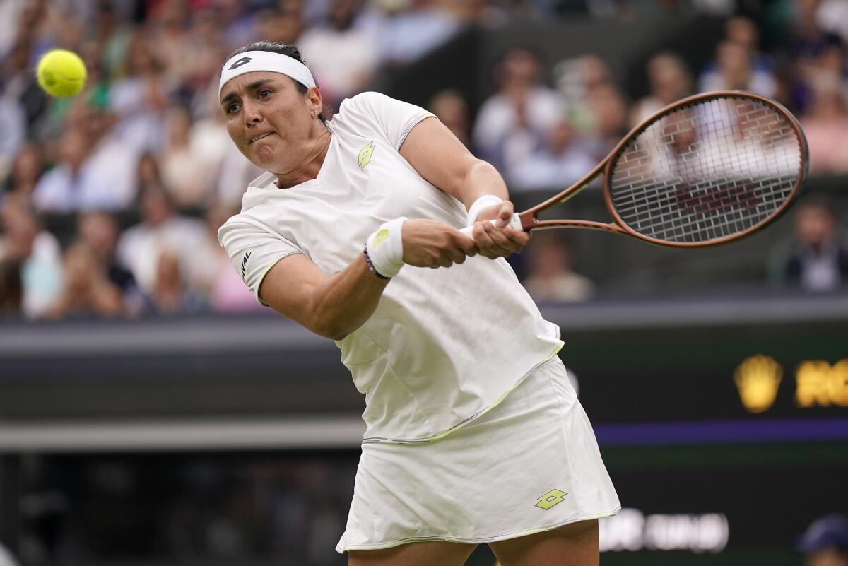 Ons Jabeur hits a return during her victory over Aryna Sabalenka in the Wimbledon women's singles semifinals.