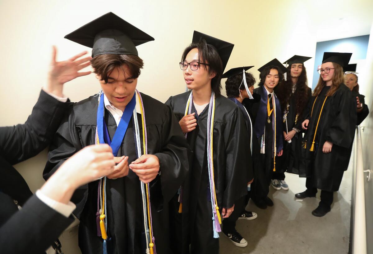Victor Jimenez, Noah Tran, Oliver Alvarado, Toby Nguyen, Caleb Jimenez and Ana Dimovski, from left, stand in line.