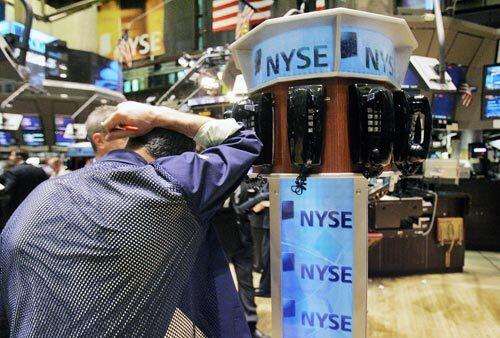 Trader Frank Cannarozzo takes a breather on the floor of the New York Stock Exchange.