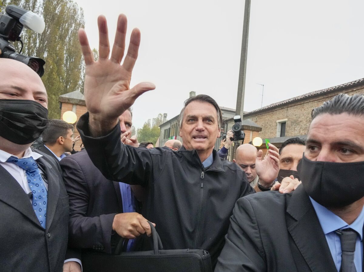 Brazil's President Jair Bolsonaro arrives in Anguillara Veneta, northern Italy, Monday, Nov. 1, 2021, where his great-great-grandfather was born and where he was recently granted honorary citizenship . The decision by the mayor of Anguillara, Alessandra Buos, has sparked protests, in particular by Italian missionaries in Brazil. (AP Photo/Luca Bruno)