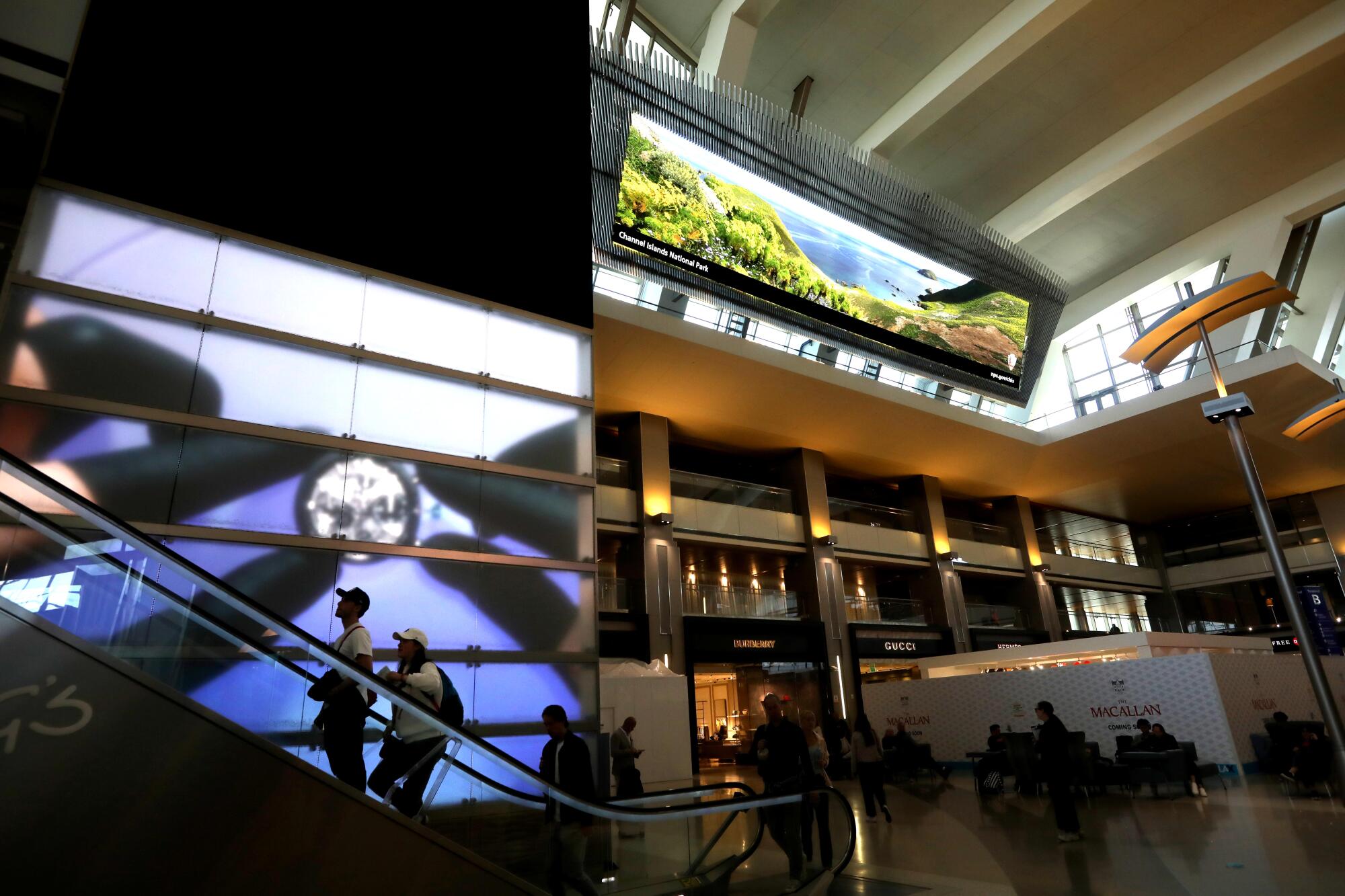 Video signage frames travelers as they make their way through the Tom Bradley International Terminal at LAX.