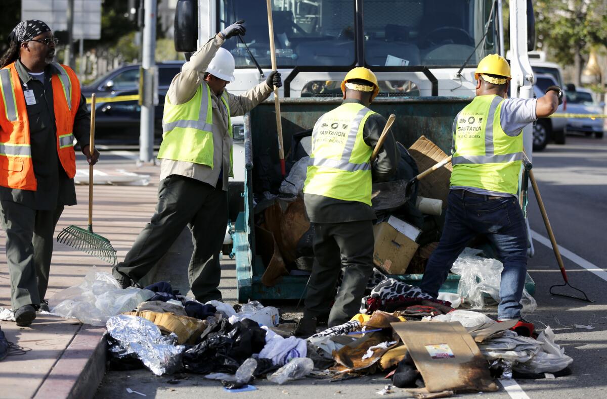 The city of Pomona will stop seizing and destroying homeless people's property under a legal settlement with Public Counsel, a Los Angeles public interest law firm. Above, a sweep of homeless people's belongings in Los Angeles.