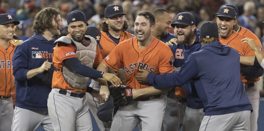 Houston Astros starter Justin Verlander celebrates with his teammates after throwing a no-hitter against the Toronto Blue Jays on Sunday.