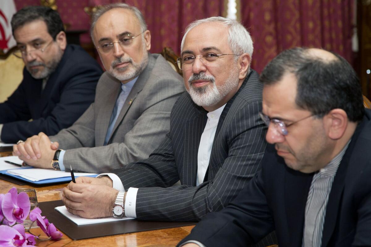 Iranian Foreign Minister Mohammad Javad Zarif, second from right, and the head of Iran's Atomic Energy Organization, Ali Akbar Salehia, second from left, sit at the negotiating table for nuclear talks in Lausanne, Switzerland. The talks are recessing until next week.