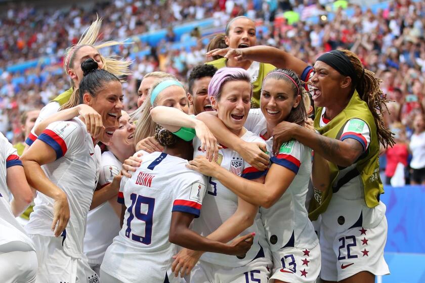 LYON, FRANCE - JULY 07: Megan Rapinoe of the USA celebrates with teammates after scoring her team’s first goal during the 2019 FIFA Women’s World Cup France Final match between The United States of America and The Netherlands at Stade de Lyon on July 07, 2019 in Lyon, France. (Photo by Richard Heathcote/Getty Images) *** BESTPIX *** ** OUTS - ELSENT, FPG, CM - OUTS * NM, PH, VA if sourced by CT, LA or MoD **