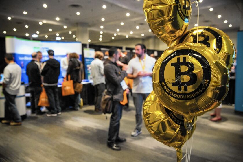 The value of a bitcoin surged to more than $400 last week from its low this year of $177.28 in mid-January. Above, people attend a Bitcoin conference in New York in 2014.
