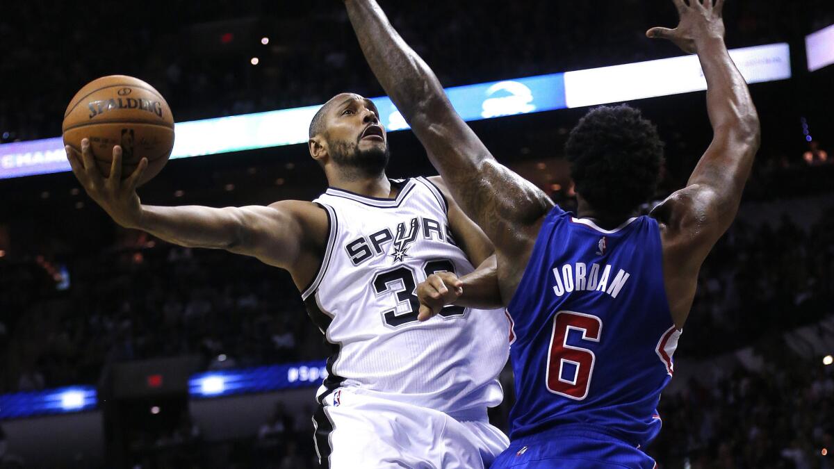 San Antonio Spurs forward Boris Diaw puts up a shot over Clippers center DeAndre Jordan during the first half of Game 4 of the Western Conference quarterfinals in San Antonio on April 26.