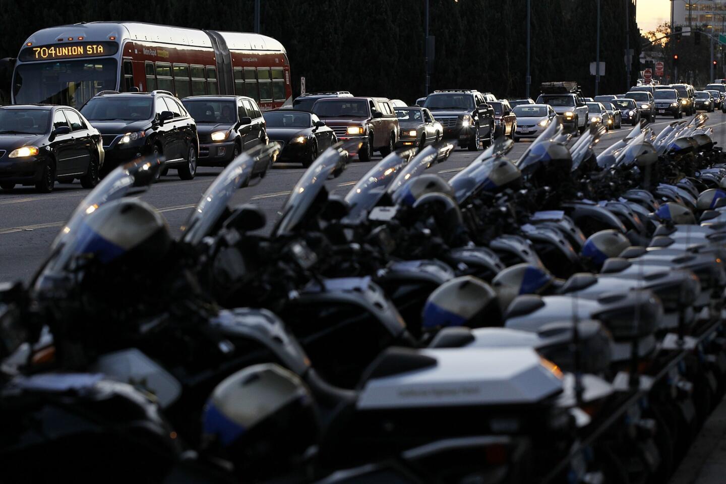 Traffic crawls along Santa Monica Boulevard as dozens of California Highway Patrol motorcycles are on standby to lead President Obama and his entourage from the Beverly Hilton Hotel during a 2012 visit.