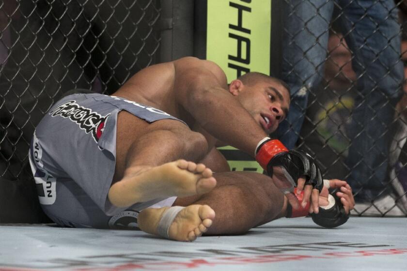 Alistair Overeem is sent to the mat by Antonio Silva during their bout on Feb. 2.