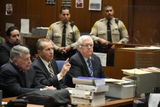 Orange County Superior Court Judge Jeffrey Ferguson, right, sits next to his attorneys John Drummond Barnett, left, and Paul Meyer during a hearing at the Clara Shortridge Foltz Criminal Justice Center, Tuesday, Aug. 15, 2023, in Los Angeles. The Southern California judge, Ferguson, charged with killing his wife during an argument while he was drunk, pleaded not guilty Tuesday, and his lawyer says it was an “accidental shooting.” (AP Photo/Damian Dovarganes, Pool)
