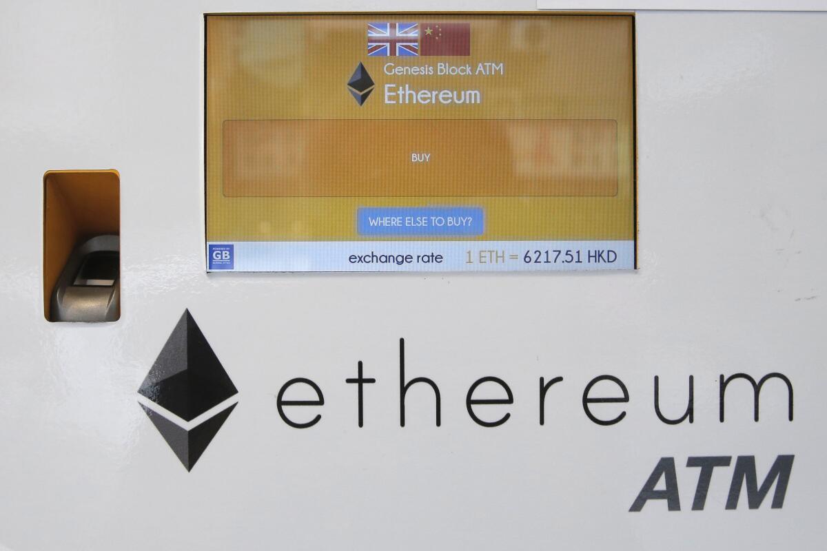 FILE - An ethereum ATM is seen in Hong Kong, Friday, May 11, 2018. A complex software change enacted Wednesday, Sept. 14, 2022, to the cryptocurrency ethereum holds the potential to dramatically reduce its energy consumption — and resulting climate-related pollution. But the transition known as "the merge" is not going to do the trick by itself. (AP Photo/Kin Cheung, File)