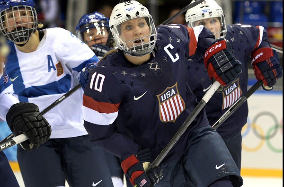 U.S. captain Meghan Duggan (10) keeps her eyes on the puck during a preliminary-round game against Finland last week.