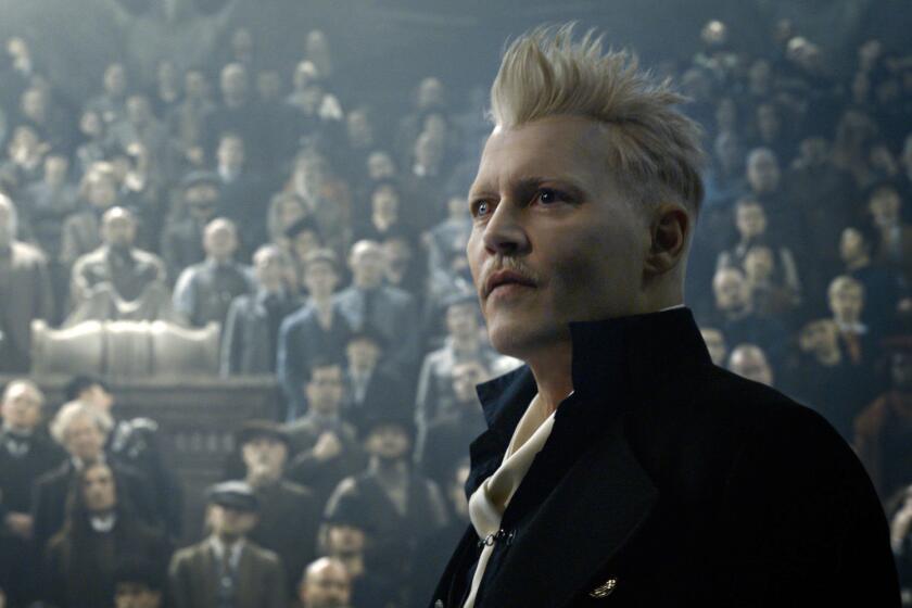 This image released by Warner Bros. Pictures shows Johnny Depp in a scene from "Fantastic Beasts: The Crimes of Grindelwald." (Warner Bros. Pictures via AP)