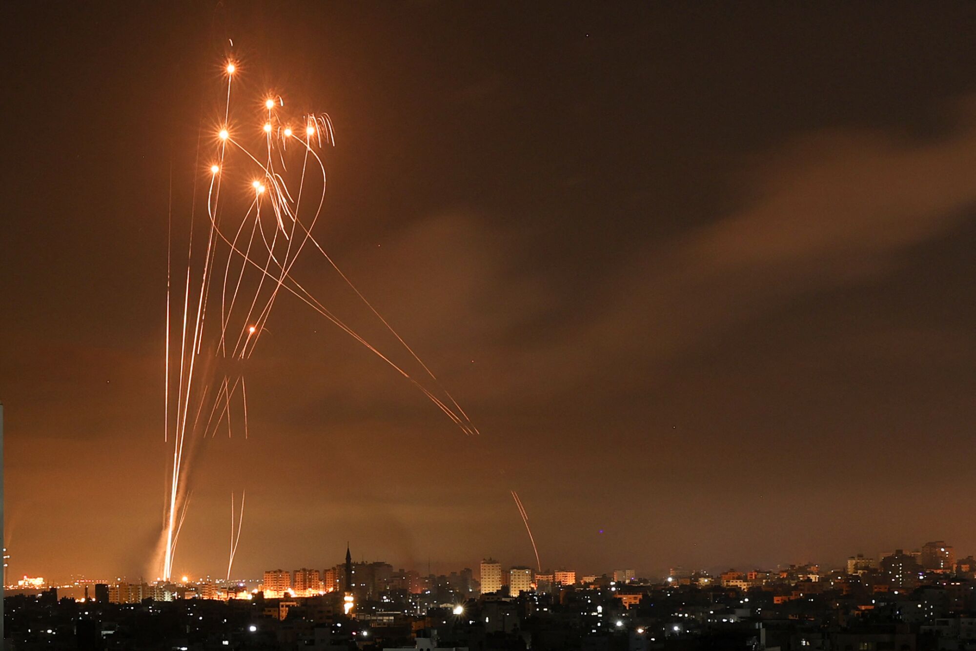 Rockets light up the night sky above Beit Lahia in the northern Gaza Strip.