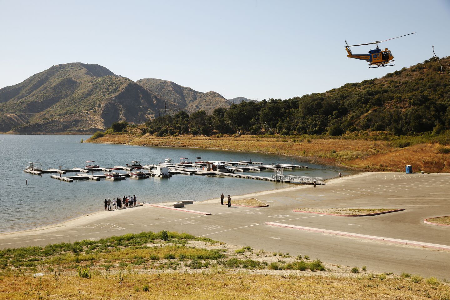 Cast members from the TV show "Glee" and friends held hands and shouted "Say her name: Naya" as they gathered Monday at the Lake Piru boat launch.