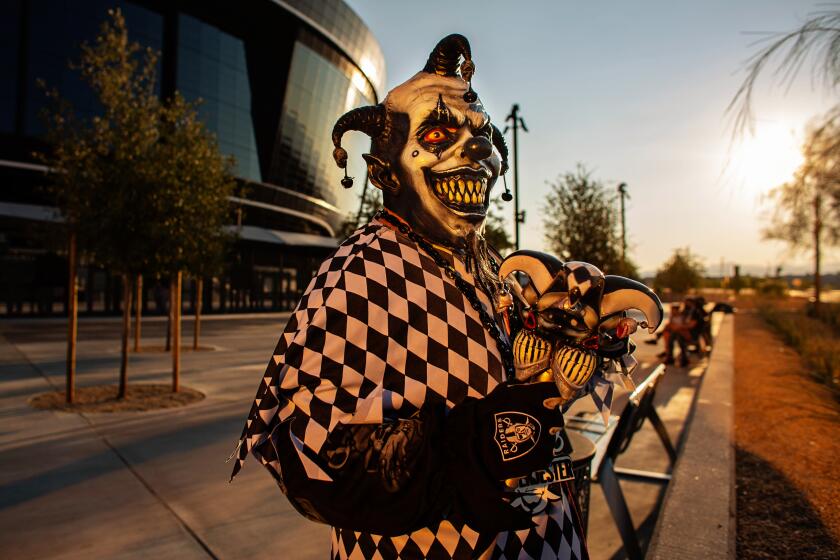 LAS VEGAS, NV - AUGUST 27: Raider superfan, Anthony Herrera of Las Vegas, aka, Raider Joker, stands for a portrait outside Allegiant Stadium the new home of Las Vegas Raiders on Thursday, Aug. 27, 2020 in Las Vegas, NV. (Jason Armond / Los Angeles Times)