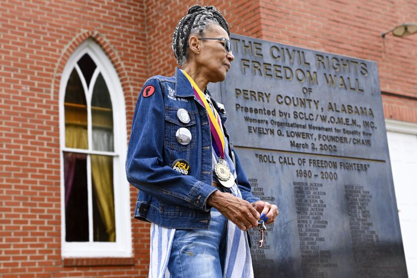 Civil Rights foot soldier Della Simpson Maynor retraces her steps on May 19, 2023, from the night she was clubbed by police on Feb. 18, 1965, at the scene of a confrontation outside Zion Church in Marion, Alabama. Maynor was 14-years-old at the time and was part of a group planning to march to the Perry County jail where a local SCLC field secretary was being held for registering voters. She also heard the gunshots that fatally wounded activist Jimmie Lee Jackson. (AP Photo/Julie Bennett)