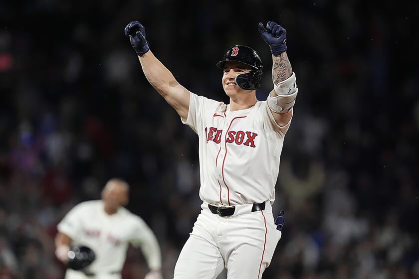 Boston Red Sox's Tyler O'Neill celebrates after his walkoff RBIi single during the ninth inning of a baseball game against the Chicago Cubs, Sunday, April 28, 2024, in Boston. (AP Photo/Michael Dwyer)