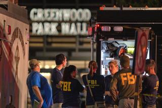 FILE - FBI agents gather at the scene of a deadly shooting, July 17, 2022, at the Greenwood Park Mall in Greenwood, Ind. The cellphone of a 20-year-old man who fatally shot three people at the Indianapolis-area mall in 2022 contained photos of Adolf Hitler, Nazi propaganda and firearms and also “extremely graphic" videos of previous mass killings, police said Thursday, July 13, 2023. (Kelly Wilkinson/The Indianapolis Star via AP, File)