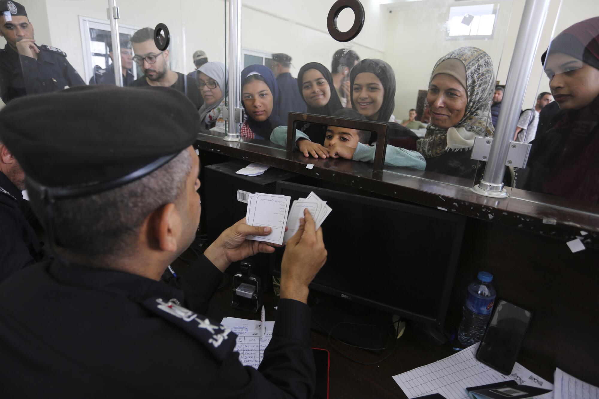 Palestinians with dual nationality registering to cross into Egypt