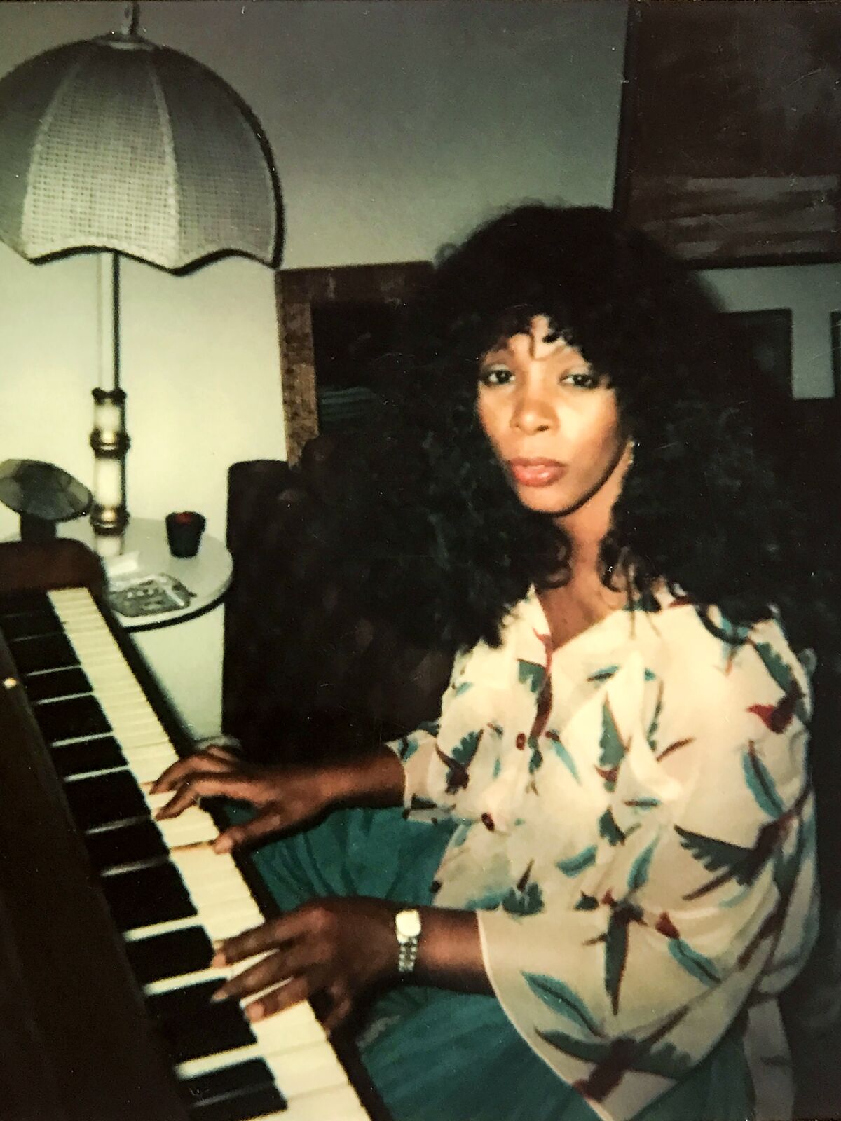 A young Donna Summer plays the piano.