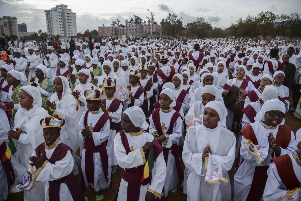 Christians from the Ethiopian Orthodox church celebrate the first day of the festival of Timkat, or Epiphany, in the capital Addis Ababa, Ethiopia Tuesday, Jan. 18, 2022. The annual festival celebrates the baptism of Jesus Christ in the River Jordan. (AP Photo)