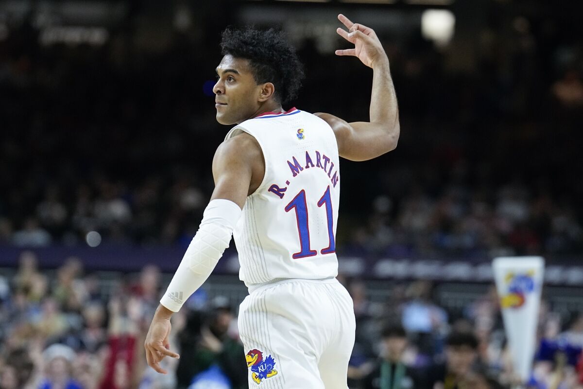 Kansas guard Remy Martin celebrates after scoring against Villanova during the first half of a college basketball game in the semifinal round of the Men's Final Four NCAA tournament, Saturday, April 2, 2022, in New Orleans. (AP Photo/Brynn Anderson)