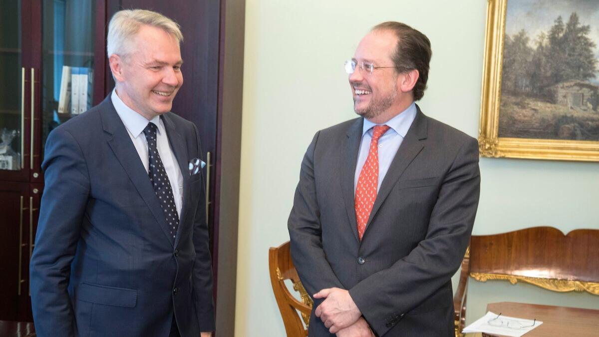 Finland's Minister of Foreign Affairs Pekka Haavisto, left, and his Austrian counterpart, Alexander Schallenberg, meet in Helsinki, Finland, on June 24, 2019.