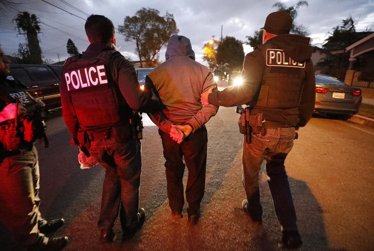 U.S. immigration and border agents take a man into custody in Bell Gardens in 2020