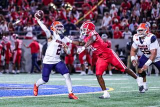 Mater Dei linebacker Nasir Wyatt pressures Bishop Gorman quarterback Melvin Spicer IV as he attempts a pass on Friday night.