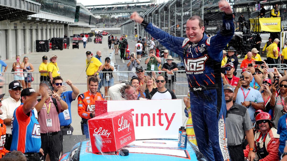 NASCAR driver Kyle Busch celebrates after winning the Xfinity Series race at Indianapolis on Saturday.