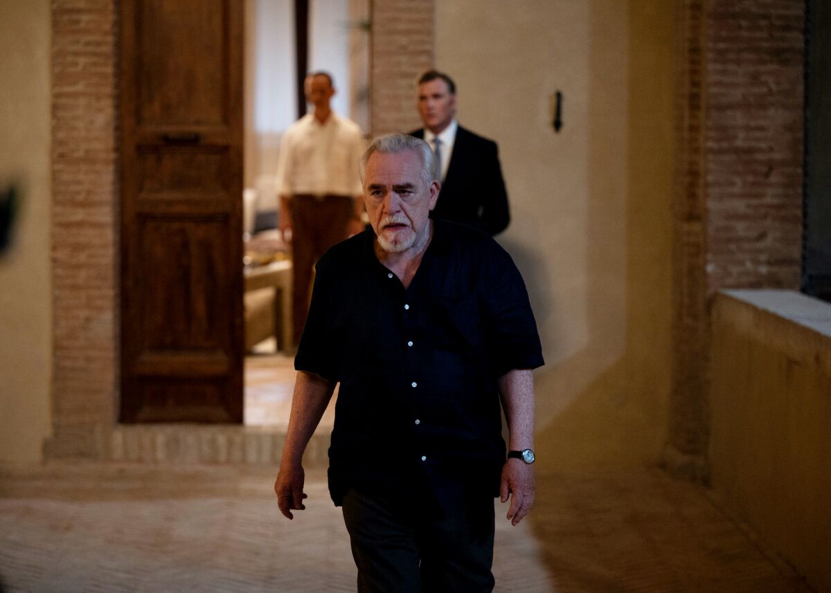 A man walks down a  hall in the season finale of "Succession."