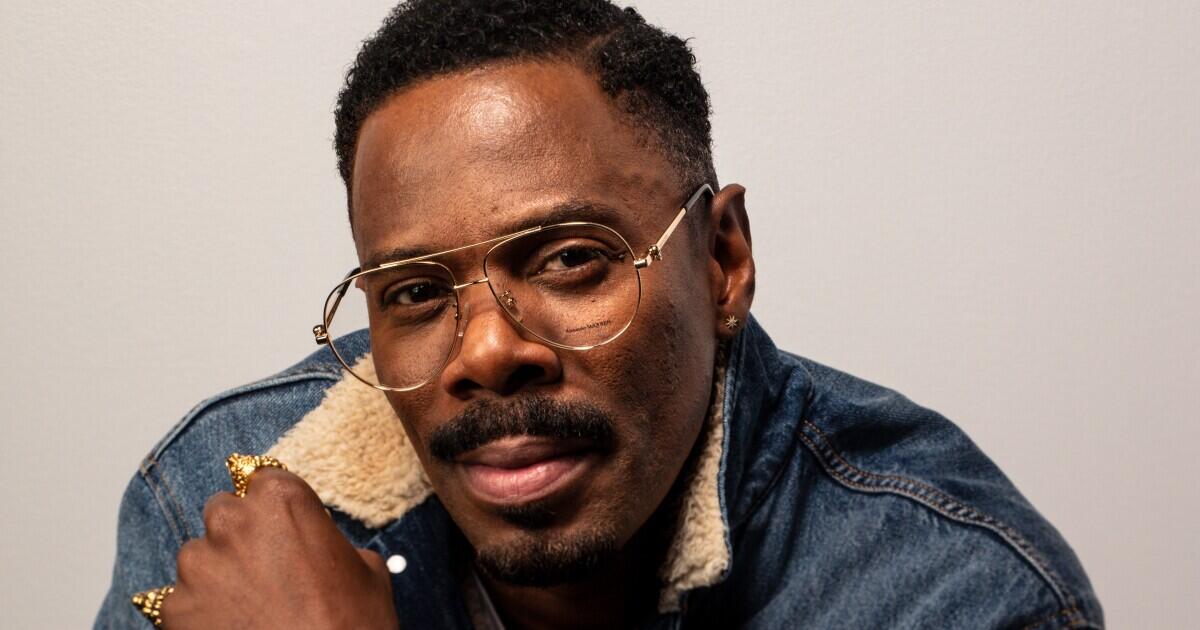 Actor Colman Domingo wearing glasses and a denim jacket